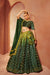 Green Velvet Sequins Embroidered All Over Mirror Work Lehenga Choli.