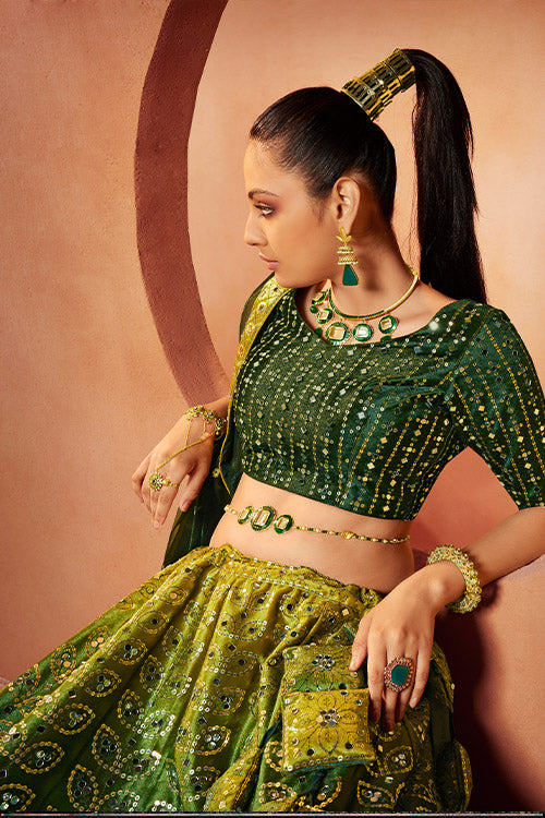 Green Velvet Sequins Embroidered All Over Mirror Work Lehenga Choli.